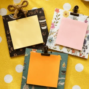 Three patterned clipboards with colorful sticky notes