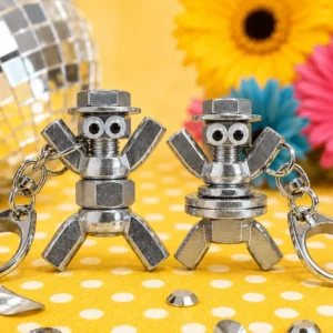 Two metal nut and bolt robot keychains