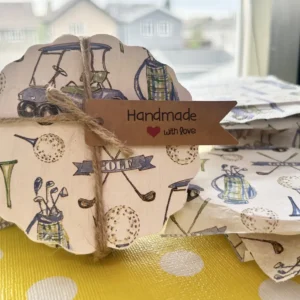 Handmade tag on golf-themed gift wrap
